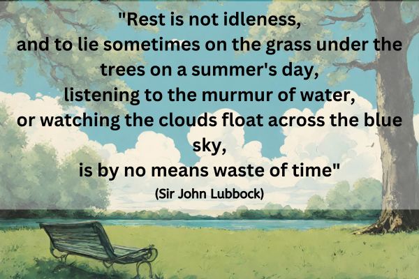 A empty green bench is in the bottom left corner surrounded by green grass and a couple of trees on the edge in the foreground. In the distance is a stretch of blue water with a distant tree line on the far bank. The sky is blue with fluffy white clouds.
The text reads: "Rest is not idleness, and to lie sometimes on the grass under the trees on a summer's day, listening to the murmur of water, or watching the clouds float across the blue sky, is by no means waste of time" (Sir John Lubbock)