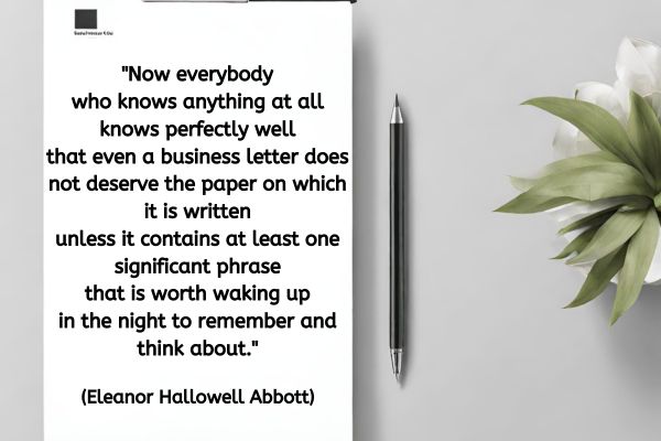 This is a shot of a light grey table top from above.  To the right there is a green leafy plant in a white pot. To the left, and taking up almost half the image is a clipboard. To the right of the clipboard is a ball point pen, with a black body with silver at both ends. On the clipboard is a piece of paper with a logo in the top left corner.
On the paper is text that reads: "Now everybody who knows anything at all knows perfectly well that even a business letter does not deserve the paper on which it is written unless  it contains at least one significant phrase that is worth waking up in the night to remember and think about." (Eleanor Hallowell Abbott)