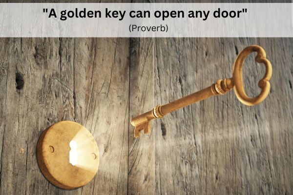 A wooden door is closed. Through the keyhole from the other side of the door, bright light shines through, illuminating a golden key that is hovering just in front of the keyhole.
The text reads: "A golden key can open any door" (Proverb)