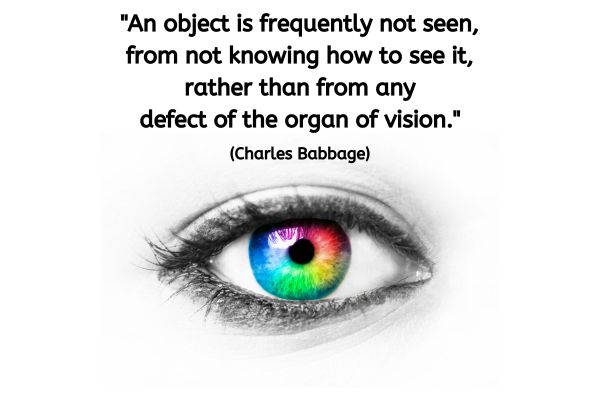 A black and white image of a single eye. The iris is brightly coloured, like a colour wheel with one colour blending into another seamlessly. The text reads: "An object is frequently not seen, from not knowing how to see it, rather than from any defect of the organ of vision." (Charles Babbage)
