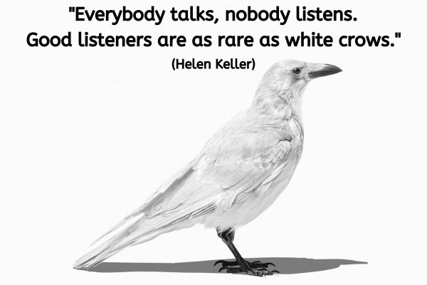 A white crow is stood facing towards the right. The text reads: "Everybody talks, nobody listens. Good listeners are as rare as white crows." (Helen Keller)