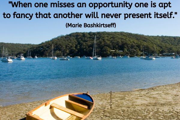 The image shows a serene scene at a beach with calm waters dotted with several sailboats anchored in the distance. The foreground features a sandy beach where a wooden row boat is resting, pulled slightly onto the shore. The sky is clear and blue, complementing the tranquil blue of the water. An inspirational quote overlays the image at the top, stating: "When one misses an opportunity one is apt to fancy that another will never present itself." It attributes the quote to Marie Bashkirtseff.