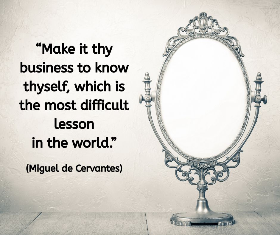 An ornate vintage mirror stands upright on a wooden surface against a soft cream wall. The reflection is empty white, inviting introspection. Overlaid text reads: “Make it thy business to know thyself, which is the most difficult lesson in the world.” (Miguel de Cervantes)