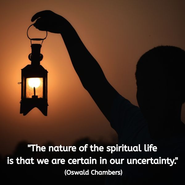 A silhouetted figure holds a lantern against the warm glow of a sunset sky. The light from the lantern aligns visually with the sun behind it, creating a soft, glowing effect. In white text beside the figure, the quote reads: "The nature of the spiritual life is that we are certain in our uncertainty." (Oswald Chambers) The image evokes a sense of inner stillness, guidance, and faith amidst the unknown.