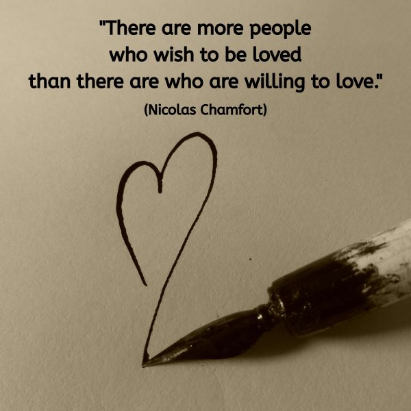 A sepia-toned image showing an old ink dip pen resting on paper. The nib has drawn a simple heart shape in black ink. Above the pen and heart, the following quote appears in dark text: "There are more people who wish to be loved than there are who are willing to love." (Nicolas Chamfort) The image suggests gentleness, vulnerability, and the act of offering love through presence and expression.